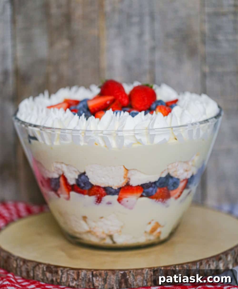 Vibrant berry trifle with red, white, and blue layers, ready to be served as a festive dessert.