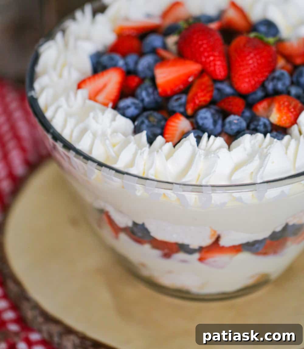 Close-up of the delicate layers within a berry trifle, highlighting fresh berries and creamy filling.