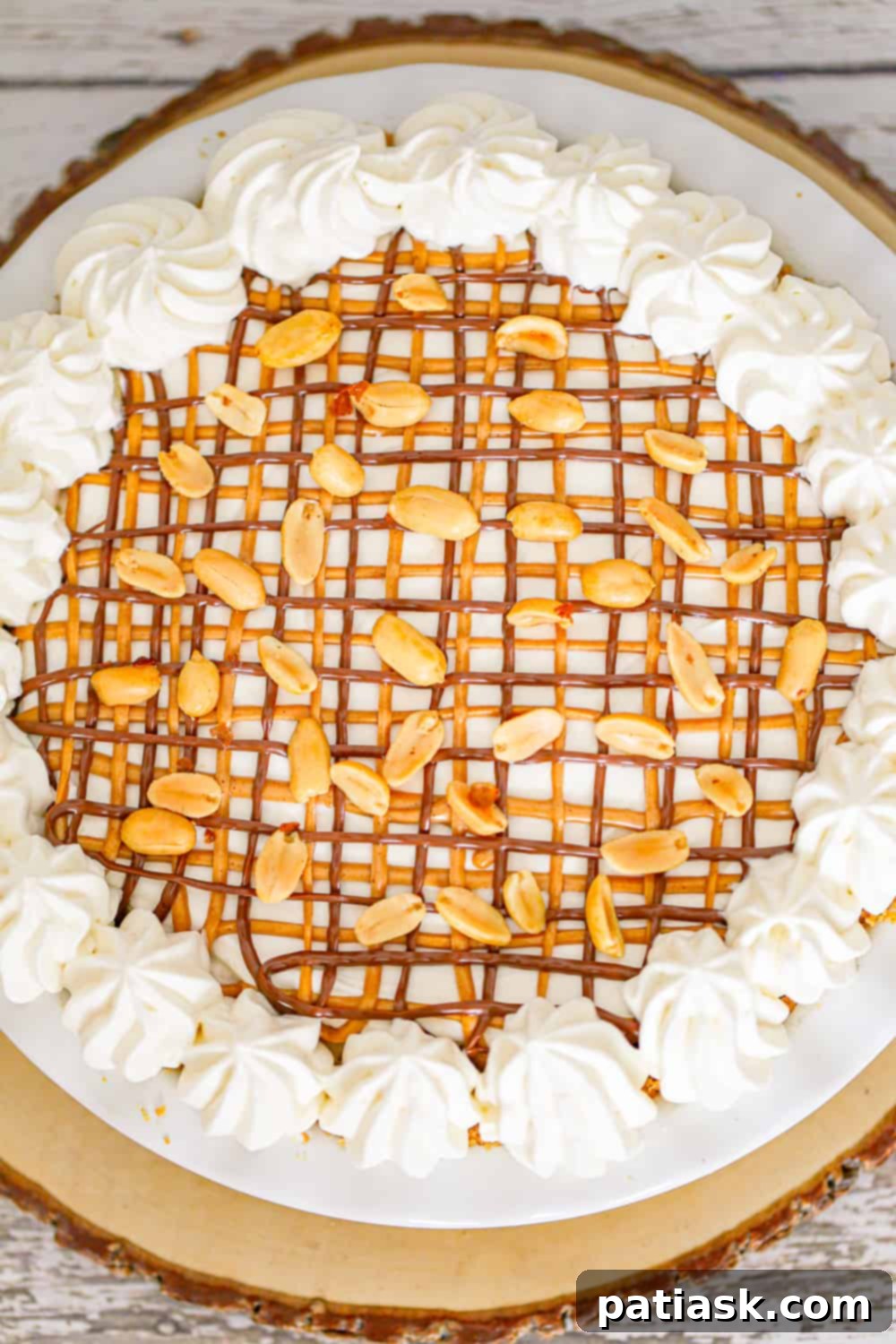 Expertly crafted no-bake peanut butter banana pie with garnishes