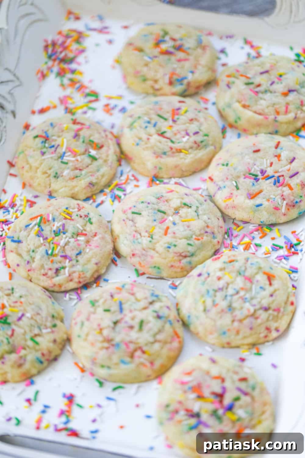 A vibrant display of freshly baked sprinkle sugar cookies, ready for a party