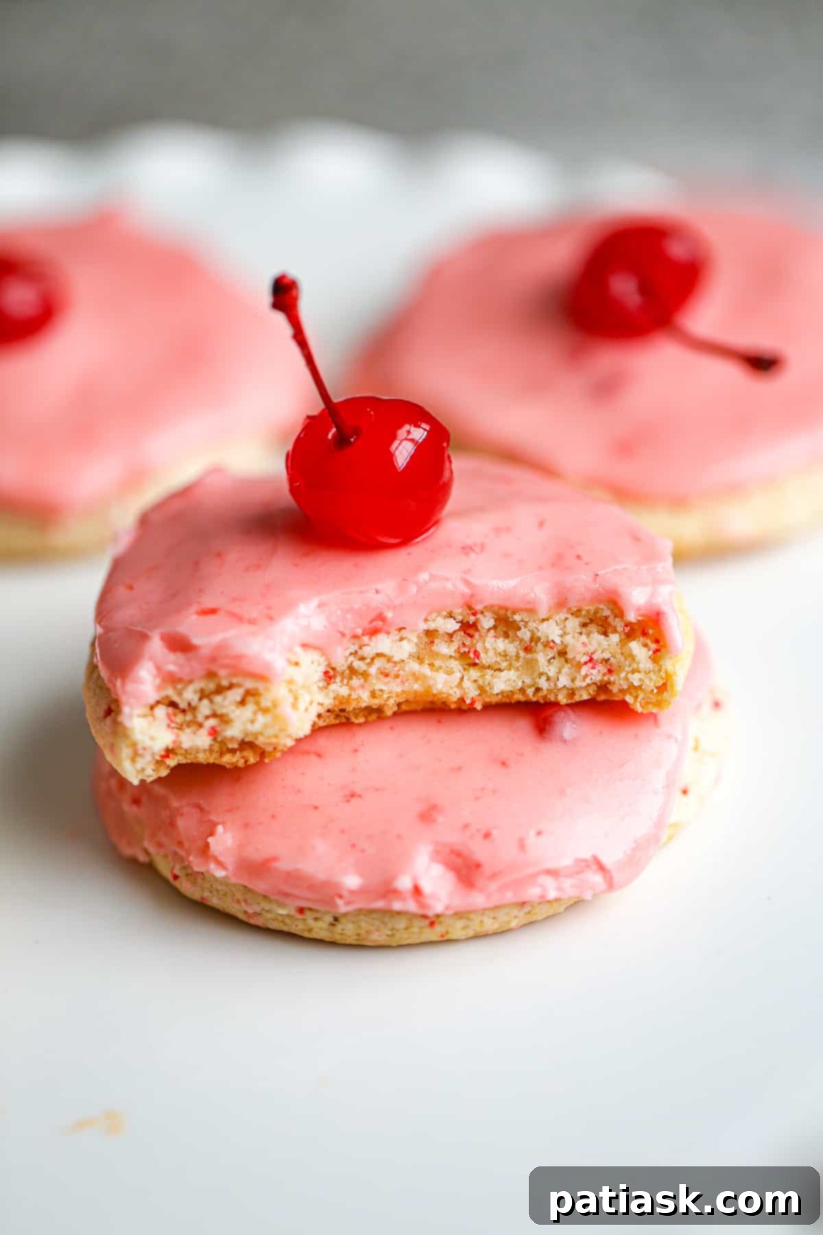 Sweet Cherry Chip Cookies 4 Close-up photograph of golden-baked Cherry Chip Cookies cooling on a wire rack after coming out of the oven