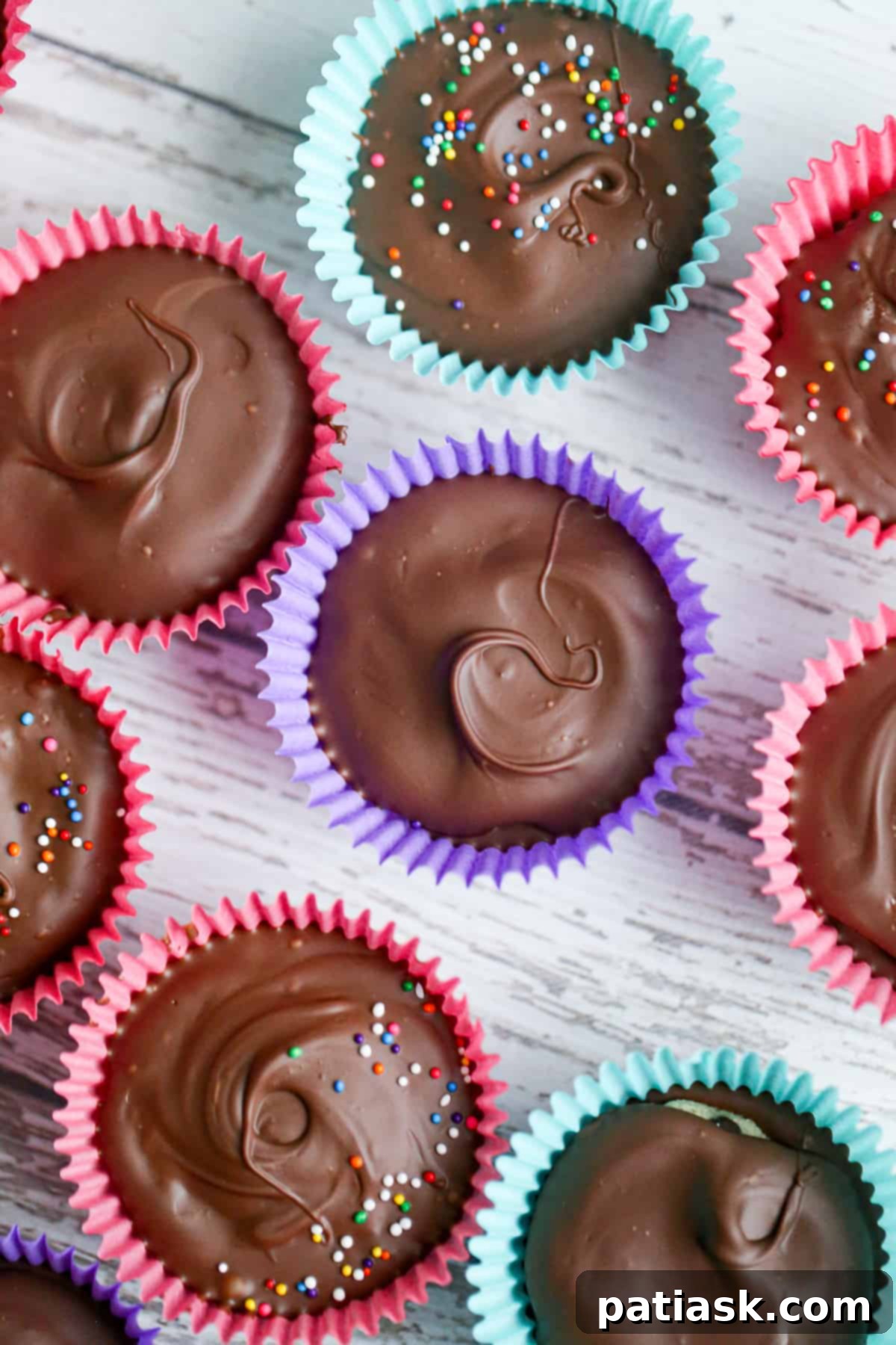 No-Bake Cookie Dough Delights 5 Assortment of finished No Bake Cookie Dough Truffle Cups with different toppings, including sprinkles and mini cookie dough balls