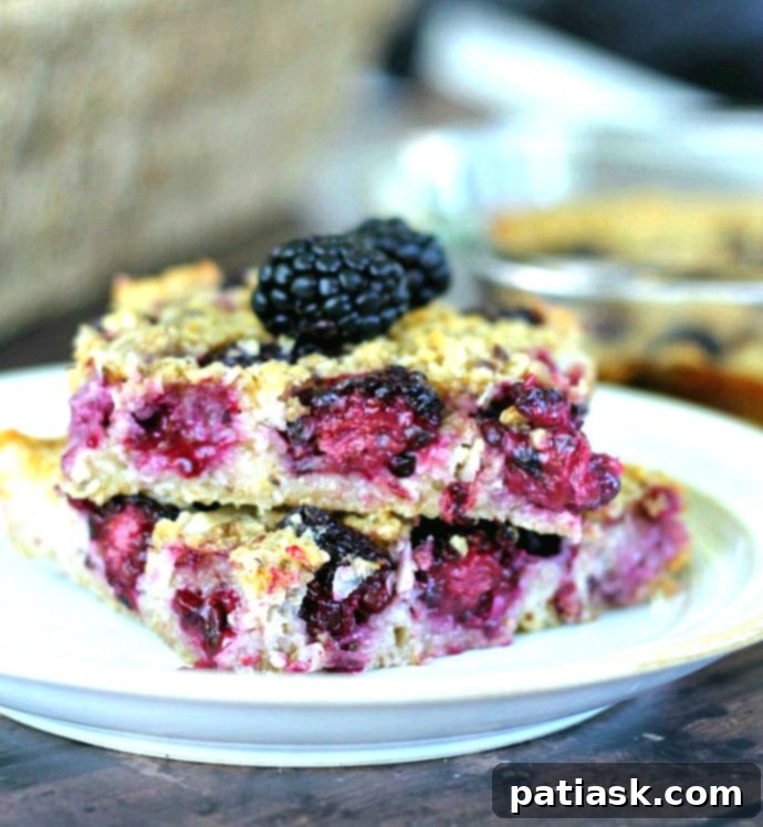 Tropical Blackberry Coconut Baked Oats 2 Baked Blackberry Coconut Oatmeal, a delicious and healthy breakfast bake featuring rolled oats, fresh blackberries, and shredded coconut.