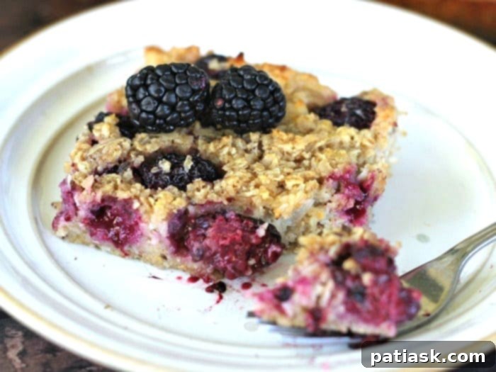 Tropical Blackberry Coconut Baked Oats 4 Overhead view of baked blackberry coconut oatmeal, served in a square dish, ready for breakfast or brunch.