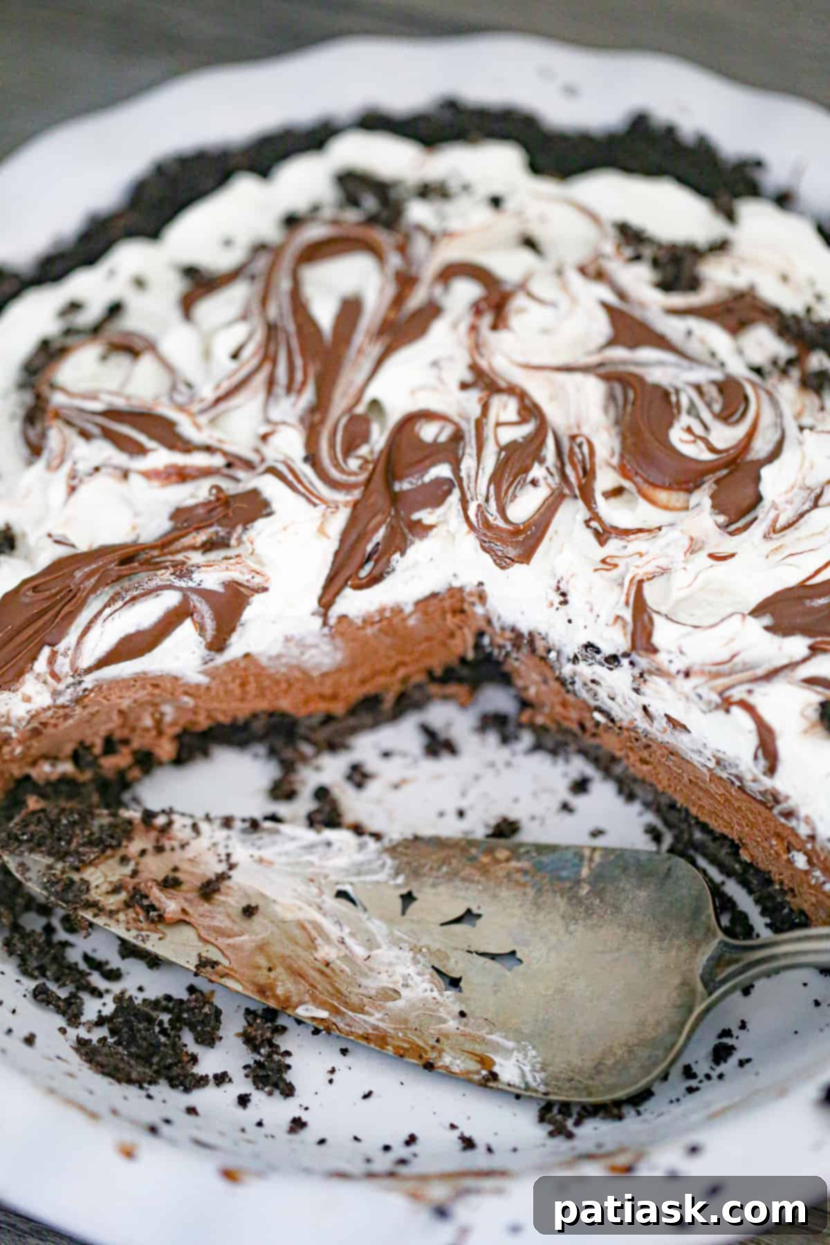 Top view of a beautifully drizzled Nutella chocolate cream pie