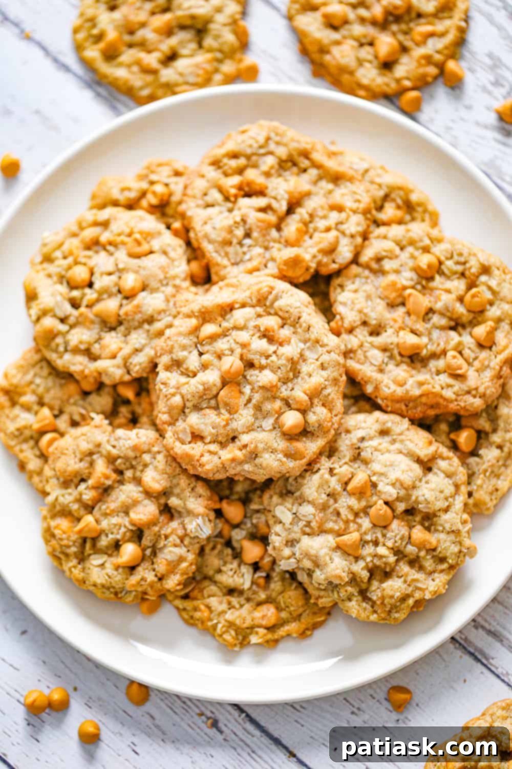 THOUGHTS:
The user wants me to translate and "özgünleştir" (make it original/creative) the given title: "Chewy Butterscotch Oatmeal Cookies".
I need to provide only ONE original title in English.
I must remove any special characters from the original title before processing (not applicable here, "Chewy Butterscotch Oatmeal Cookies" has no special characters).
I must NOT add any special characters like asterisks.
I must NOT use introductory phrases like "İşte özgün başlık:".
The output should be *only* the new, original title. Original title: Chewy Butterscotch Oatmeal Cookies Translation: Çiğnenebilir Karamelli Yulaflı Kurabiyeler (This is just for my understanding, not part of the output) Now, make it original/creative while conveying the core idea: chewy, butterscotch, oatmeal, cookies. Ideas for originality:
- Focus on the experience: "Melt-in-your-mouth," "Irresistible," "Dreamy."
- Combine elements creatively: "Golden," "Caramel-Kissed."
- Evoke warmth/comfort.
- Keep it concise and appealing. Let's break down the elements to re-imagine them:
- Chewy: Velvety, Soft-Baked, Perfectly Chewy, Tender
- Butterscotch: Golden Butterscotch, Caramel Swirl, Toffee Bits (if applicable, but butterscotch is the key), Sweet Scotch
- Oatmeal: Hearty Oats, Wholesome Oats, Rolled Oats
- Cookies: Treats, Delights, Bites, Gems Combining some:
1. Golden Butterscotch Oatmeal Delights (A bit too long maybe)
2. Soft-Baked Butterscotch Oat Cookies (Good, but "Soft-Baked" replaces "Chewy" which is okay)
3. Caramel Swirl Oat Cookies (Doesn't explicitly say butterscotch, which might be important)
4. Chewy Butterscotch Oat Treats (Good, but still very close to original)
5. Velvet Butterscotch Oatmeal Cookies (Velvet for chewy texture)
6. Butterscotch Oat Chewies (Concise, but maybe too informal?)
7. Golden Oat Butterscotch Bites (Good, concise)
8. Irresistible Butterscotch Oatmeal Cookies (Focus on appeal)
9. Dreamy Butterscotch Oat Cookies (Evokes pleasantness)
10. Caramelized Oat Butterscotch Cookies (Caramelized implies the flavor, maybe too strong?)
11. Classic Butterscotch Oatmeal Delights (Adds "classic" touch)
12. Sweet Scotch Oat Cookies (Shortens butterscotch to sweet scotch) I need ONE *original* title.
"Chewy Butterscotch Oatmeal Cookies" - the main descriptors are there. I need to rephrase them to sound more appealing or unique. Let's try to focus on the key elements and a touch of allure.
"Chewy" can be replaced by a feeling of indulgence or texture.
"Butterscotch" is a specific flavor.
"Oatmeal" is the base. How about something that highlights the indulgence and the flavor? "Golden Butterscotch Oat Cookies" - "Golden" implies the color and richness of butterscotch, "Oat Cookies" is clear. It's concise.
"Soft-Baked Butterscotch Oat Delights" - "Soft-Baked" conveys chewy, "Delights" is more appealing than cookies.
"Caramel-Kissed Oatmeal Cookies" - "Caramel-Kissed" for butterscotch flavor. I like "Golden Butterscotch Oat Cookies" - it's descriptive, appealing, and concise.
I also like "Soft-Baked Butterscotch Oat Delights" - it emphasizes texture and appeal. Let's go with one that captures the essence but sounds a bit more evocative.
"Golden Butterscotch Oat Cookies" is a strong contender.
"Irresistible Butterscotch Oat Bites" - emphasizes appeal and snack size. I need to choose one that is distinctly different but still clear. Let's consider the elements again:
- **Chewy**: Soft-baked, tender, pillowy, gooey, dreamily soft
- **Butterscotch**: Golden, caramel-kissed, toffee-infused, sweet scotch
- **Oatmeal**: Hearty oat, wholesome oat, rolled oat
- **Cookies**: Delights, treats, bites, gems, wonders How about something like:
"Golden Butterscotch Oat Delights" - This sounds good. "Golden" for the color/richness, "Butterscotch Oat" for the ingredients, "Delights" for the appeal. It hits all the points. Another option: "Soft-Baked Butterscotch Oat Wonders" - "Wonders" is a bit strong.
"Caramel-Kissed Oat Cookies" - This is nice, but "caramel-kissed" might be slightly less specific than "butterscotch." Let's stick with "Golden Butterscotch Oat Delights." It's original, appealing, and captures the essence. 2 A plate stacked high with homemade chewy butterscotch oatmeal cookies, warm and inviting.