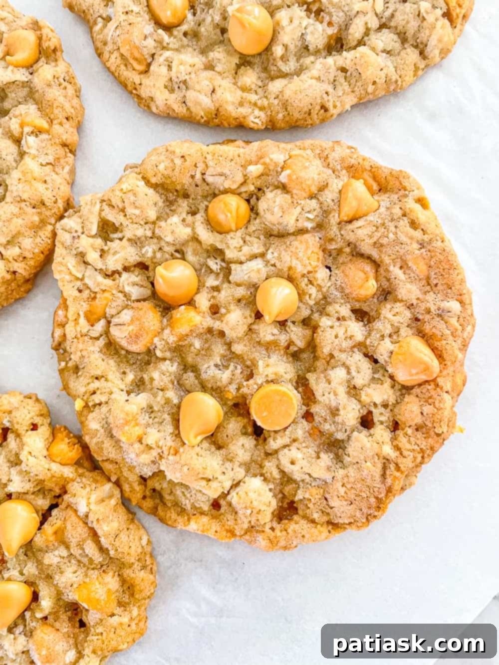 THOUGHTS:
The user wants me to translate and "özgünleştir" (make it original/creative) the given title: "Chewy Butterscotch Oatmeal Cookies".
I need to provide only ONE original title in English.
I must remove any special characters from the original title before processing (not applicable here, "Chewy Butterscotch Oatmeal Cookies" has no special characters).
I must NOT add any special characters like asterisks.
I must NOT use introductory phrases like "İşte özgün başlık:".
The output should be *only* the new, original title. Original title: Chewy Butterscotch Oatmeal Cookies Translation: Çiğnenebilir Karamelli Yulaflı Kurabiyeler (This is just for my understanding, not part of the output) Now, make it original/creative while conveying the core idea: chewy, butterscotch, oatmeal, cookies. Ideas for originality:
- Focus on the experience: "Melt-in-your-mouth," "Irresistible," "Dreamy."
- Combine elements creatively: "Golden," "Caramel-Kissed."
- Evoke warmth/comfort.
- Keep it concise and appealing. Let's break down the elements to re-imagine them:
- Chewy: Velvety, Soft-Baked, Perfectly Chewy, Tender
- Butterscotch: Golden Butterscotch, Caramel Swirl, Toffee Bits (if applicable, but butterscotch is the key), Sweet Scotch
- Oatmeal: Hearty Oats, Wholesome Oats, Rolled Oats
- Cookies: Treats, Delights, Bites, Gems Combining some:
1. Golden Butterscotch Oatmeal Delights (A bit too long maybe)
2. Soft-Baked Butterscotch Oat Cookies (Good, but "Soft-Baked" replaces "Chewy" which is okay)
3. Caramel Swirl Oat Cookies (Doesn't explicitly say butterscotch, which might be important)
4. Chewy Butterscotch Oat Treats (Good, but still very close to original)
5. Velvet Butterscotch Oatmeal Cookies (Velvet for chewy texture)
6. Butterscotch Oat Chewies (Concise, but maybe too informal?)
7. Golden Oat Butterscotch Bites (Good, concise)
8. Irresistible Butterscotch Oatmeal Cookies (Focus on appeal)
9. Dreamy Butterscotch Oat Cookies (Evokes pleasantness)
10. Caramelized Oat Butterscotch Cookies (Caramelized implies the flavor, maybe too strong?)
11. Classic Butterscotch Oatmeal Delights (Adds "classic" touch)
12. Sweet Scotch Oat Cookies (Shortens butterscotch to sweet scotch) I need ONE *original* title.
"Chewy Butterscotch Oatmeal Cookies" - the main descriptors are there. I need to rephrase them to sound more appealing or unique. Let's try to focus on the key elements and a touch of allure.
"Chewy" can be replaced by a feeling of indulgence or texture.
"Butterscotch" is a specific flavor.
"Oatmeal" is the base. How about something that highlights the indulgence and the flavor? "Golden Butterscotch Oat Cookies" - "Golden" implies the color and richness of butterscotch, "Oat Cookies" is clear. It's concise.
"Soft-Baked Butterscotch Oat Delights" - "Soft-Baked" conveys chewy, "Delights" is more appealing than cookies.
"Caramel-Kissed Oatmeal Cookies" - "Caramel-Kissed" for butterscotch flavor. I like "Golden Butterscotch Oat Cookies" - it's descriptive, appealing, and concise.
I also like "Soft-Baked Butterscotch Oat Delights" - it emphasizes texture and appeal. Let's go with one that captures the essence but sounds a bit more evocative.
"Golden Butterscotch Oat Cookies" is a strong contender.
"Irresistible Butterscotch Oat Bites" - emphasizes appeal and snack size. I need to choose one that is distinctly different but still clear. Let's consider the elements again:
- **Chewy**: Soft-baked, tender, pillowy, gooey, dreamily soft
- **Butterscotch**: Golden, caramel-kissed, toffee-infused, sweet scotch
- **Oatmeal**: Hearty oat, wholesome oat, rolled oat
- **Cookies**: Delights, treats, bites, gems, wonders How about something like:
"Golden Butterscotch Oat Delights" - This sounds good. "Golden" for the color/richness, "Butterscotch Oat" for the ingredients, "Delights" for the appeal. It hits all the points. Another option: "Soft-Baked Butterscotch Oat Wonders" - "Wonders" is a bit strong.
"Caramel-Kissed Oat Cookies" - This is nice, but "caramel-kissed" might be slightly less specific than "butterscotch." Let's stick with "Golden Butterscotch Oat Delights." It's original, appealing, and captures the essence. 8 A basket full of homemade butterscotch oatmeal cookies, invitingly presented.