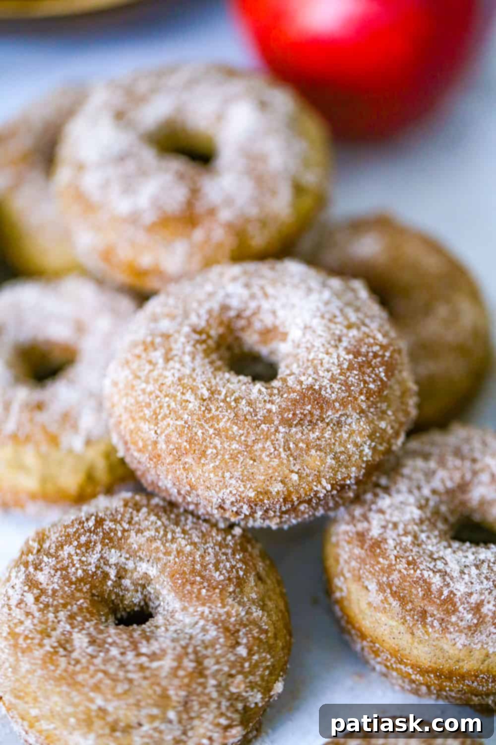 Warm Apple Cinnamon Baked Donuts 8 easy baked apple donuts recipe with cinnamon sugar coating