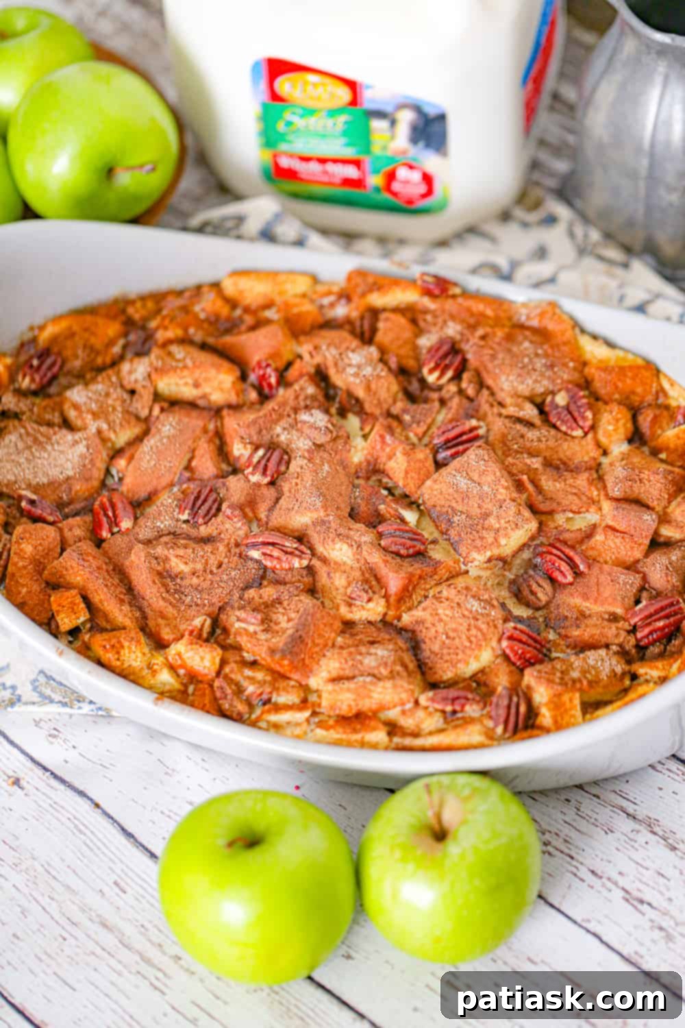 Unbaked Apple Bread Pudding mixture in a casserole dish
