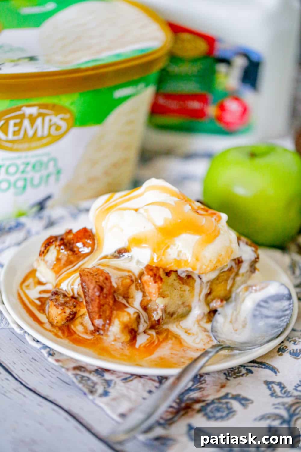 Easy Apple Bread Pudding served with caramel sauce and ice cream