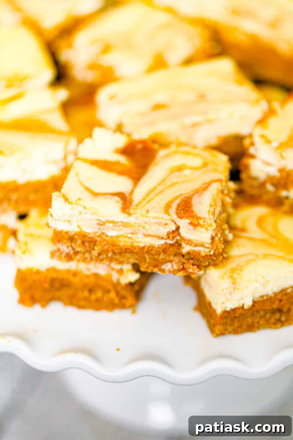 Effortless Pumpkin Cheesecake Bars 5 Close-up of a Pumpkin Cheesecake Bar recipe highlighting its deliciousness.