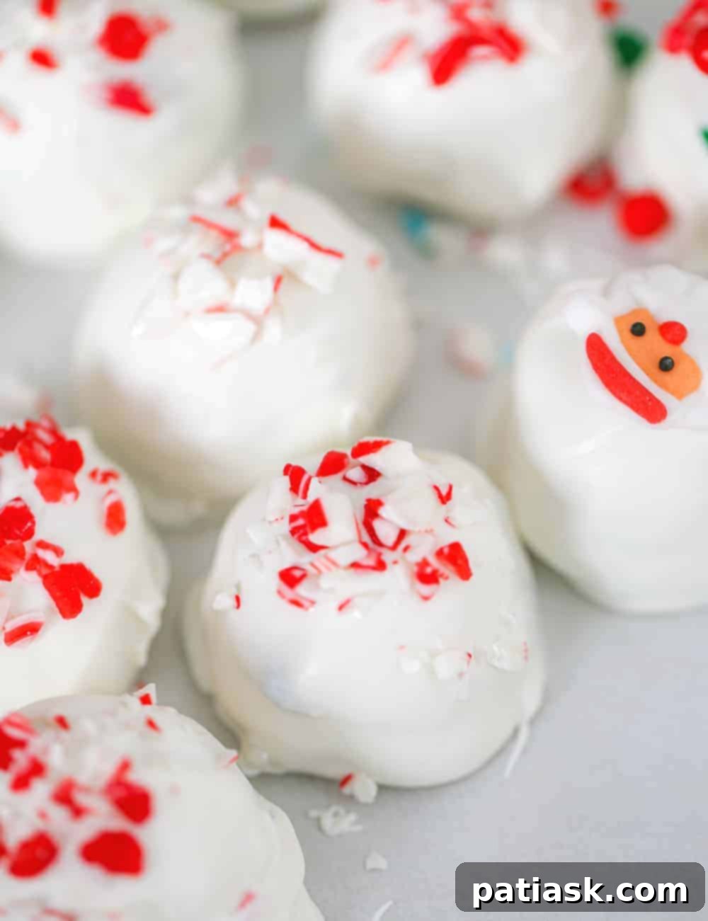 Crushed Peppermint Oreo Delights 3 Close-up of festive Oreo peppermint truffles adorned with candy canes