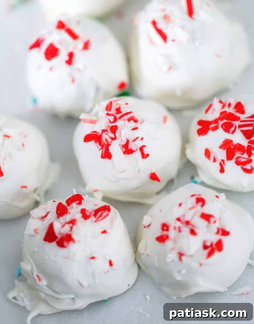 Crushed Peppermint Oreo Delights 6 A close-up shot of a perfect Christmas Peppermint Oreo Truffle