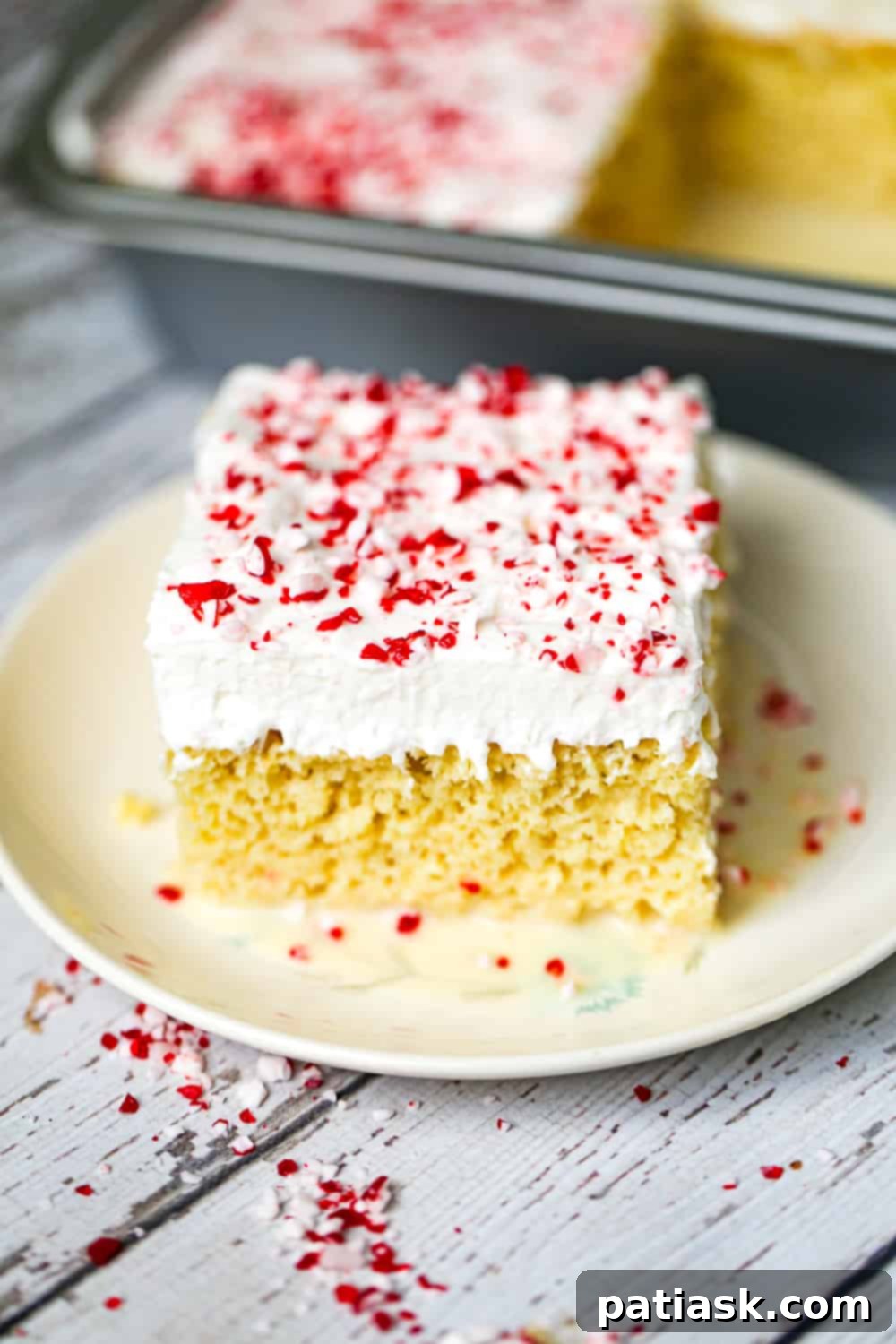 Christmas-themed Peppermint Tres Leches Cake on a serving platter