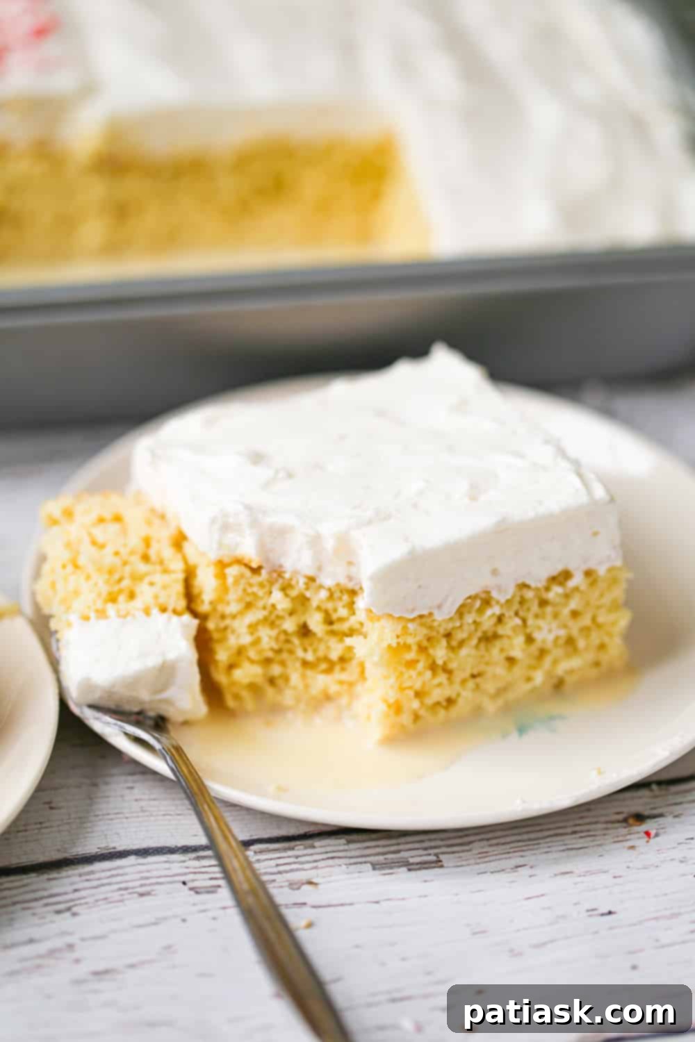 Classic Vanilla Tres Leches Cake with whipped topping