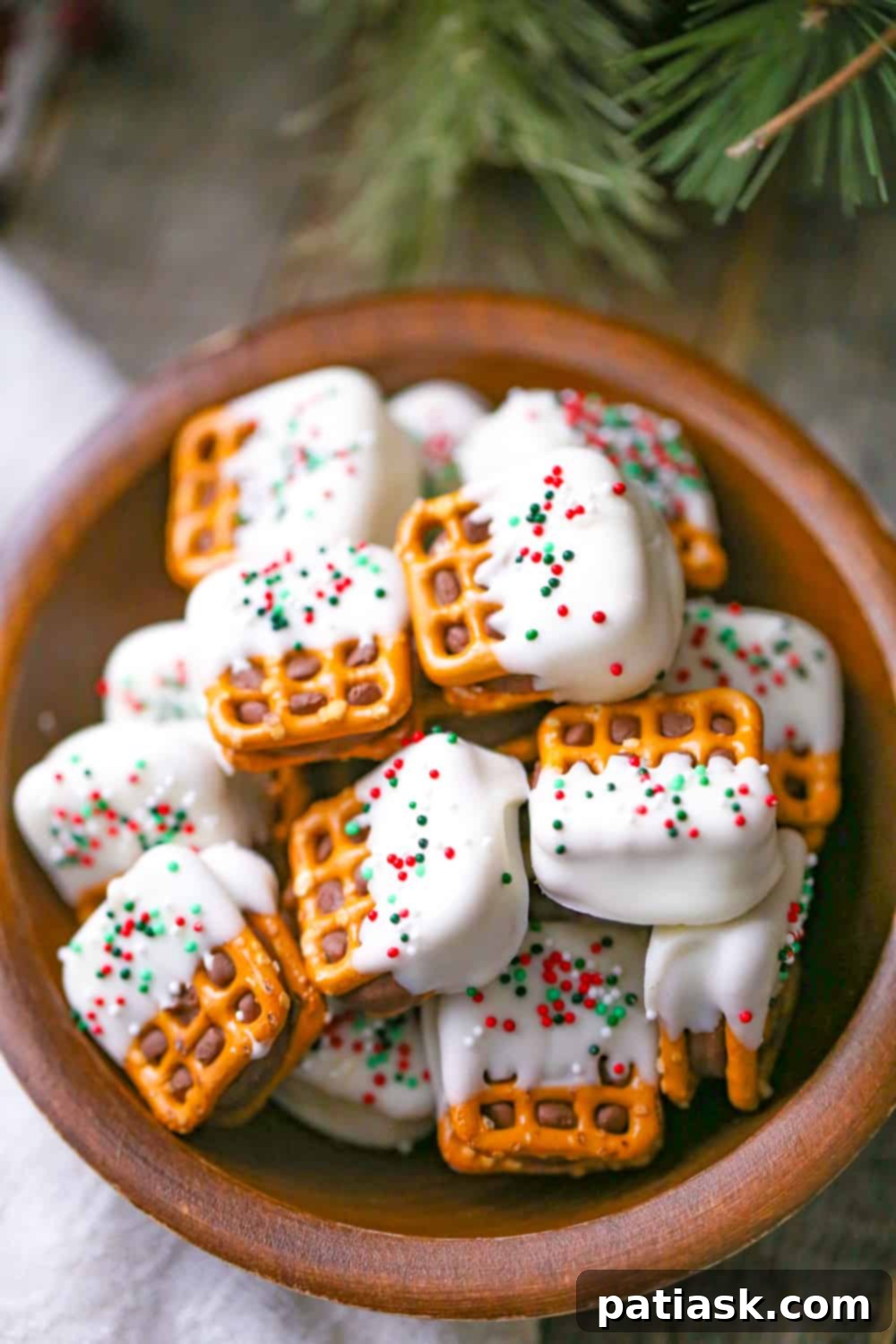 White Chocolate Pretzel Rolo Delights 2 Delicious White Chocolate Pretzel Rolo Bites on a white tray