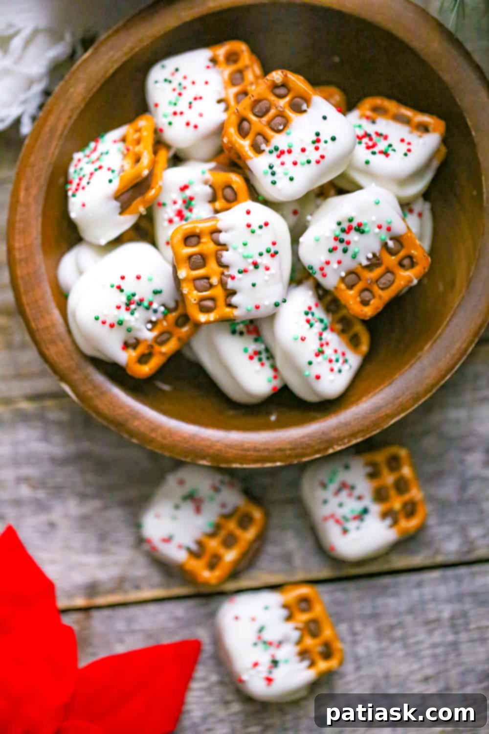 White Chocolate Pretzel Rolo Delights 4 Stack of White Chocolate Pretzel Rolo Bites with Christmas sprinkles
