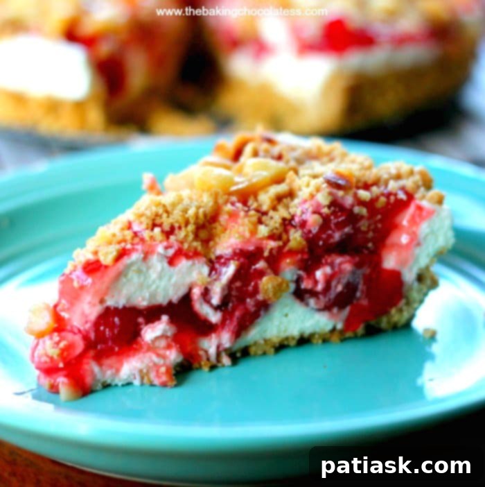 25 Heavenly Summer Desserts 15 White Chocolate Cherry Vanilla Cheesecake, showcasing a slice with cherry topping and a creamy filling.