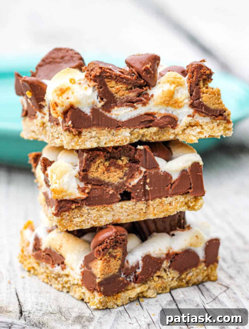 25 Heavenly Summer Desserts 18 Reese's S'mores Graham Cracker Candy bars on a baking sheet, showing melted chocolate and marshmallows.