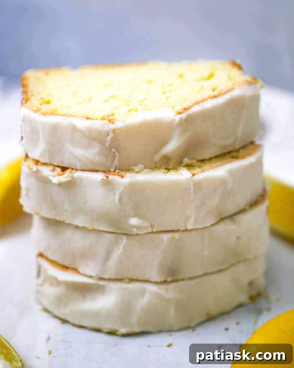 25 Heavenly Summer Desserts 8 Two slices of Starbucks CopyCat Lemon Loaf, showing the moist crumb and lemon glaze.