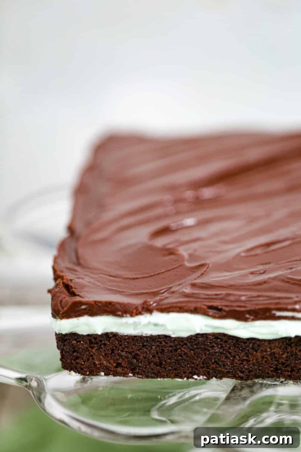 Cool Mint Chocolate Brownie Stack 6 Stacked mint chocolate layered brownies showcasing the distinct green and brown layers.