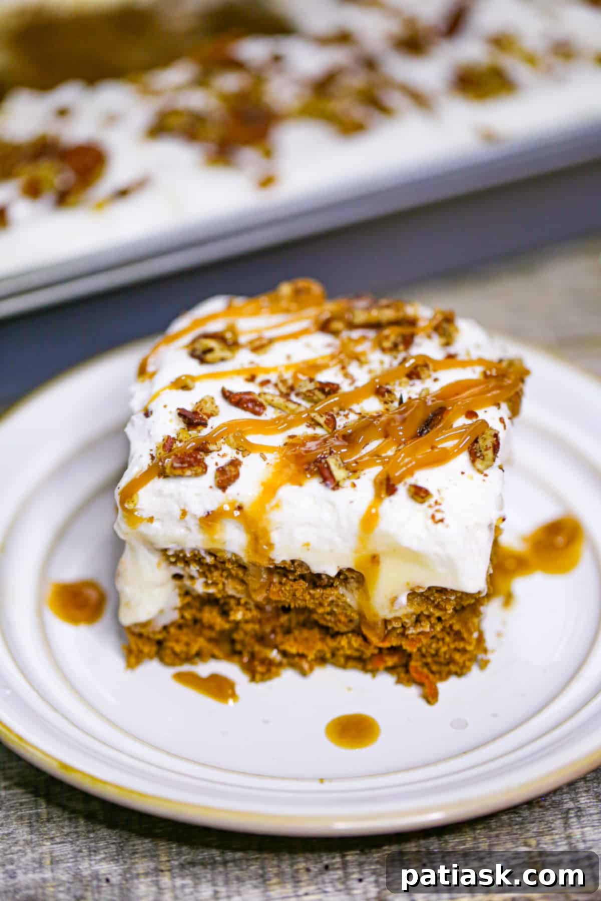 Carrot Cake Delight with Creamy Pockets 7 Slice of Carrot Cake Poke Cake ready to be eaten