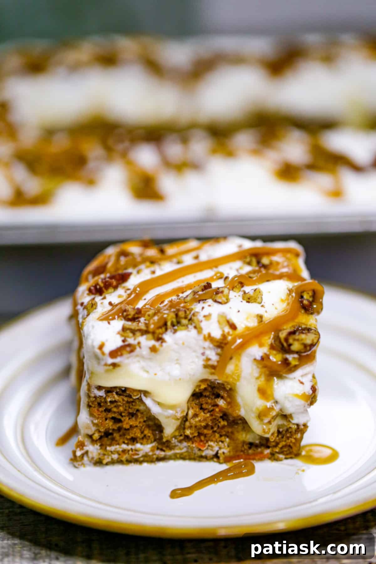 Carrot Cake Delight with Creamy Pockets 4 Close-up of Carrot Cake Poke Cake with cheesecake pudding visible in holes