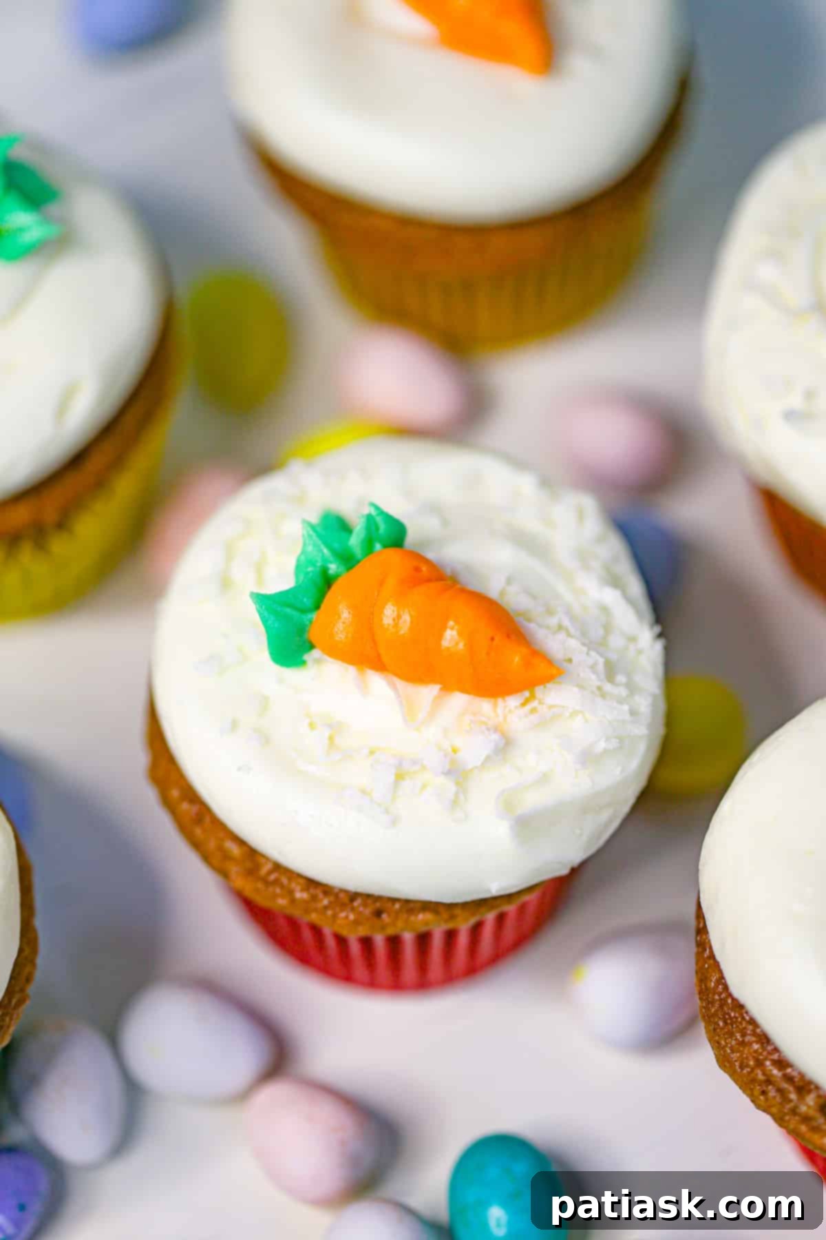 carrot cake cupcake recipe featuring a beautifully frosted cupcake