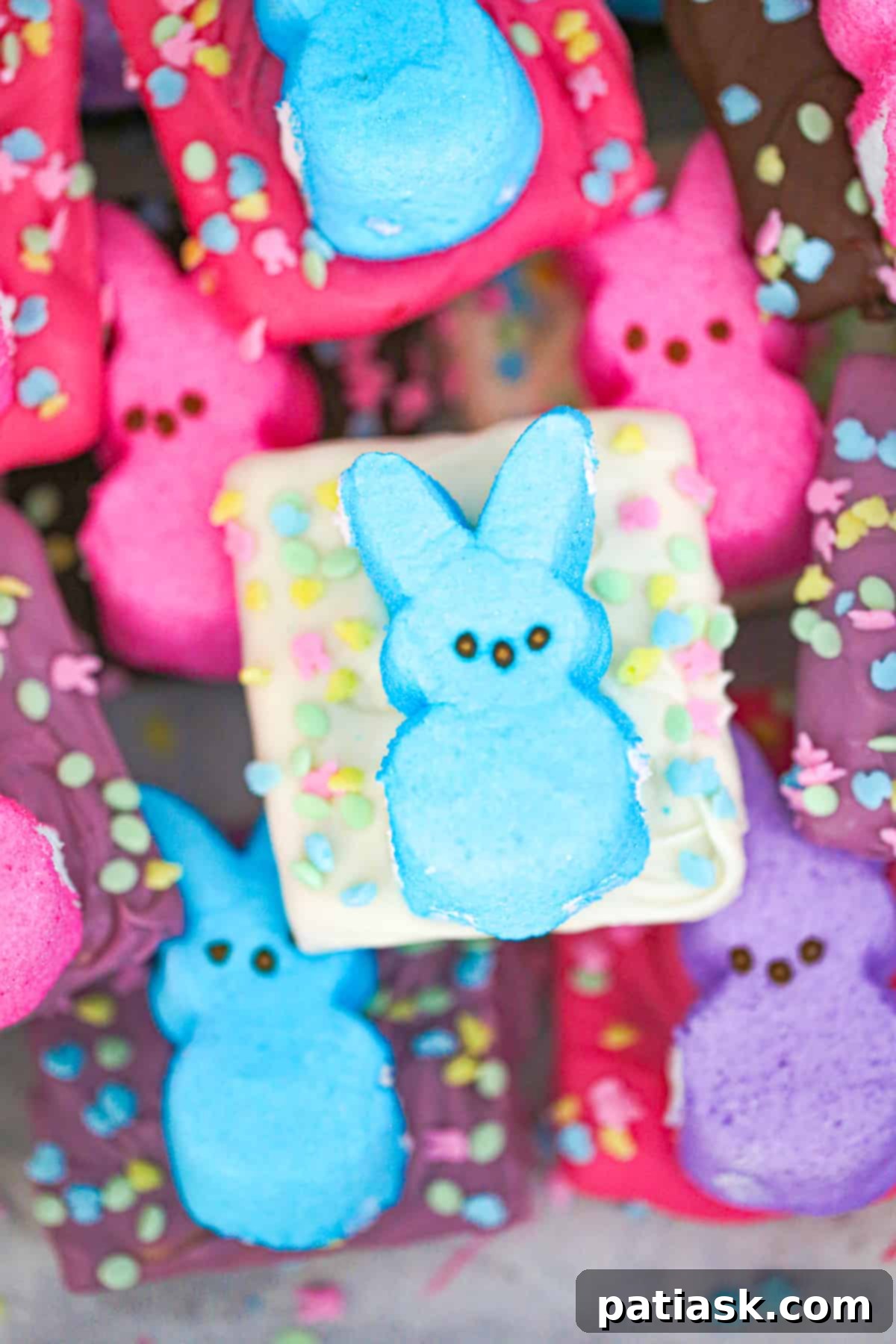 Homemade chocolate graham crackers being dipped in chocolate