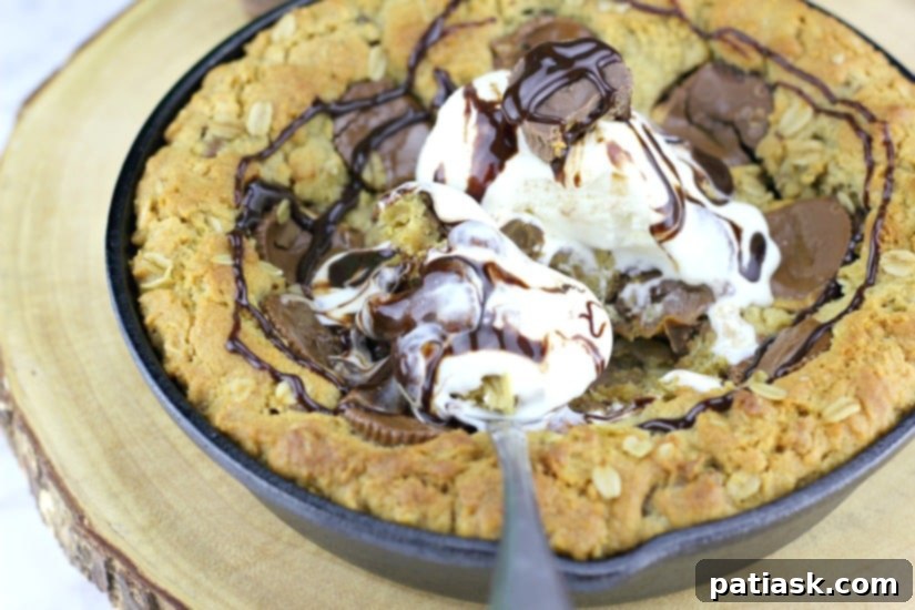 Decadent Peanut Butter Cup Skillet Cookie 6 Peanut Butter Cup Oatmeal Chocolate Chip Skillet Cookie ready to be served