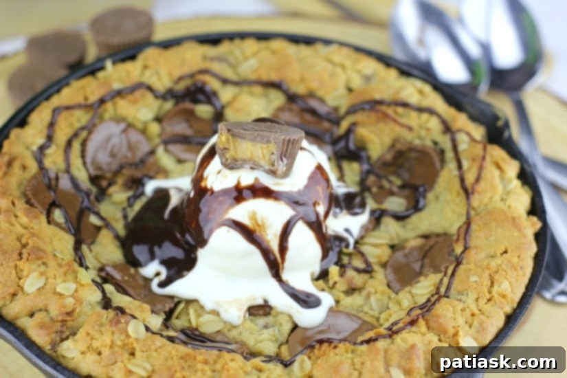 Decadent Peanut Butter Cup Skillet Cookie 3 Close-up of a warm Peanut Butter Cup Oatmeal Chocolate Chip Skillet Cookie