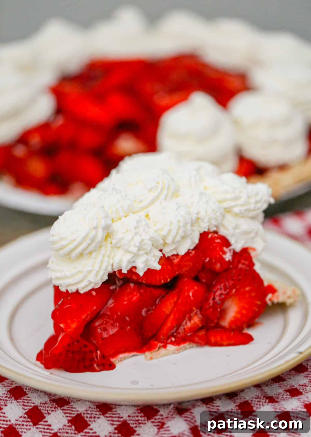 The Authentic Shoney's Strawberry Pie Copycat 2 Freshly baked strawberry pie with a vibrant red glaze and whole strawberries, ready to be served.