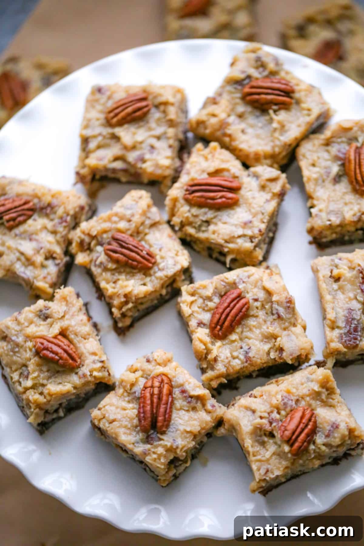 Close-up of a pan of German Chocolate Brownies, showing the rich coconut pecan frosting