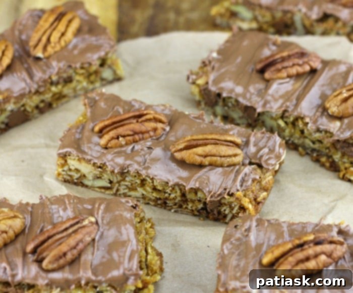 Decadent Caramel Pecan Chocolate Oat Squares 4 Freshly baked Caramel Pecan Chocolate Oat Cookie Bars cooling in a pan