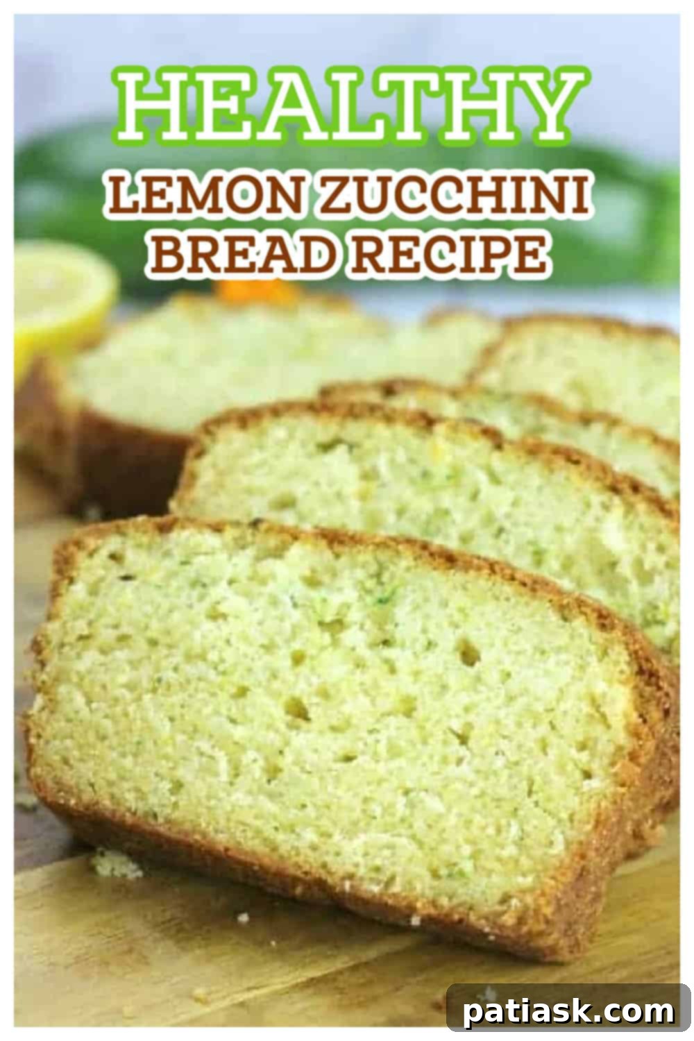 Whole Lemon Zucchini Bread loaf decorated with fresh lemon slices