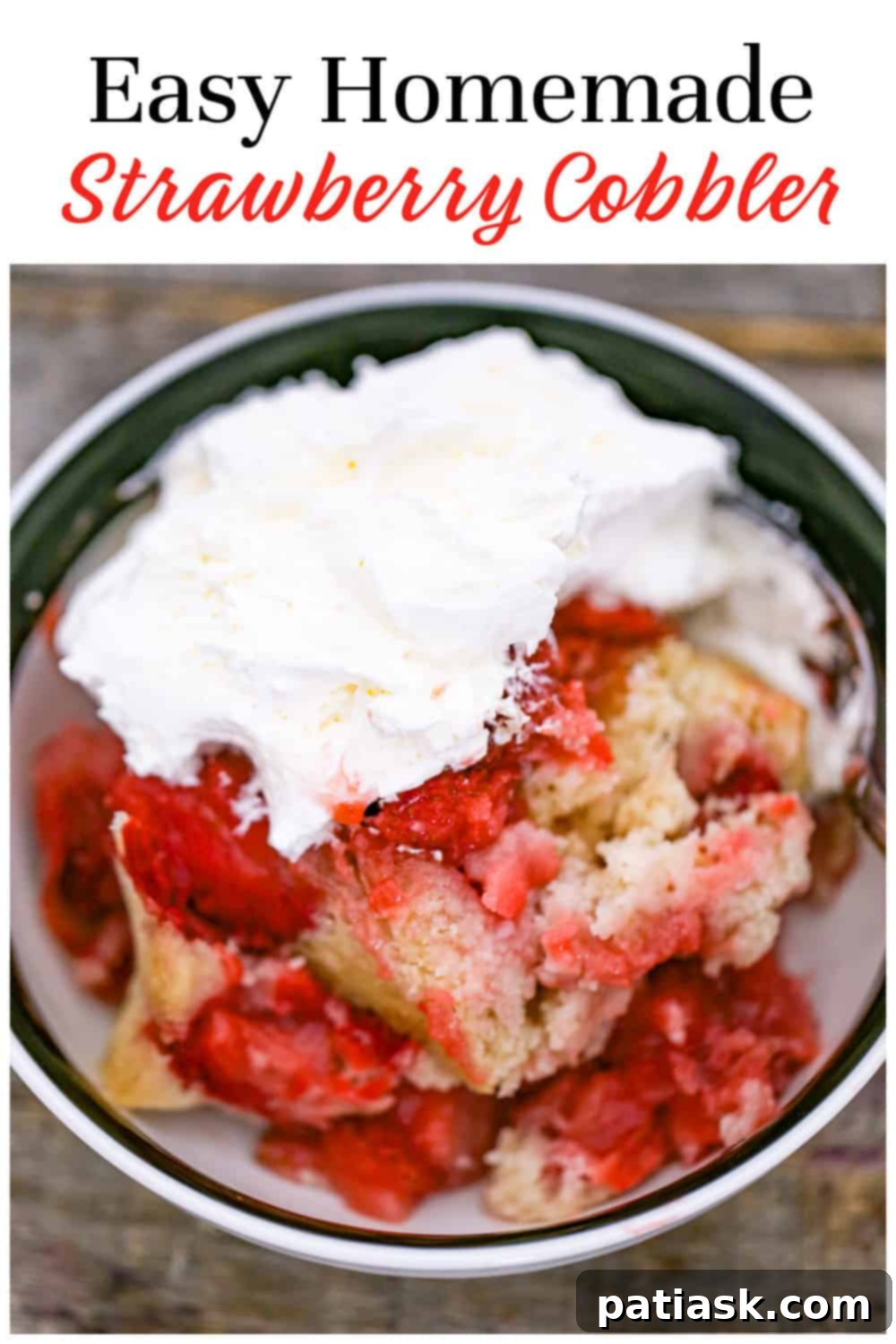 Best Strawberry Cobbler, served in a bowl with a spoonful of ice cream.