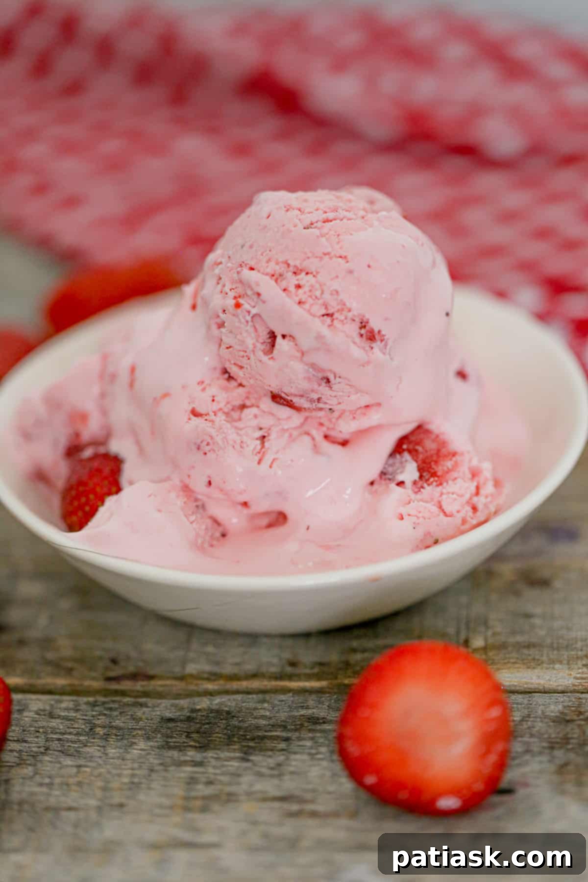 Effortless Strawberry Bliss: No-Churn Ice Cream 8 Creamy No Churn Strawberry Ice Cream in a bowl