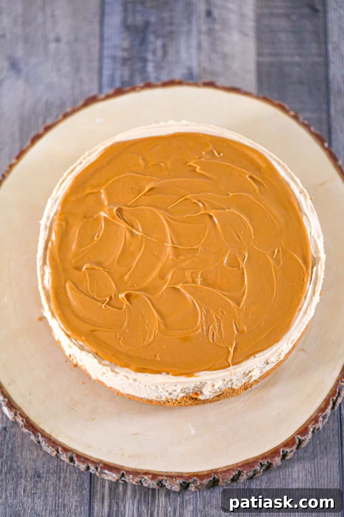 Effortless No-Bake Biscoff Cheesecake 9 Overhead shot of a full No-Bake Biscoff Cheesecake with elegant decorations