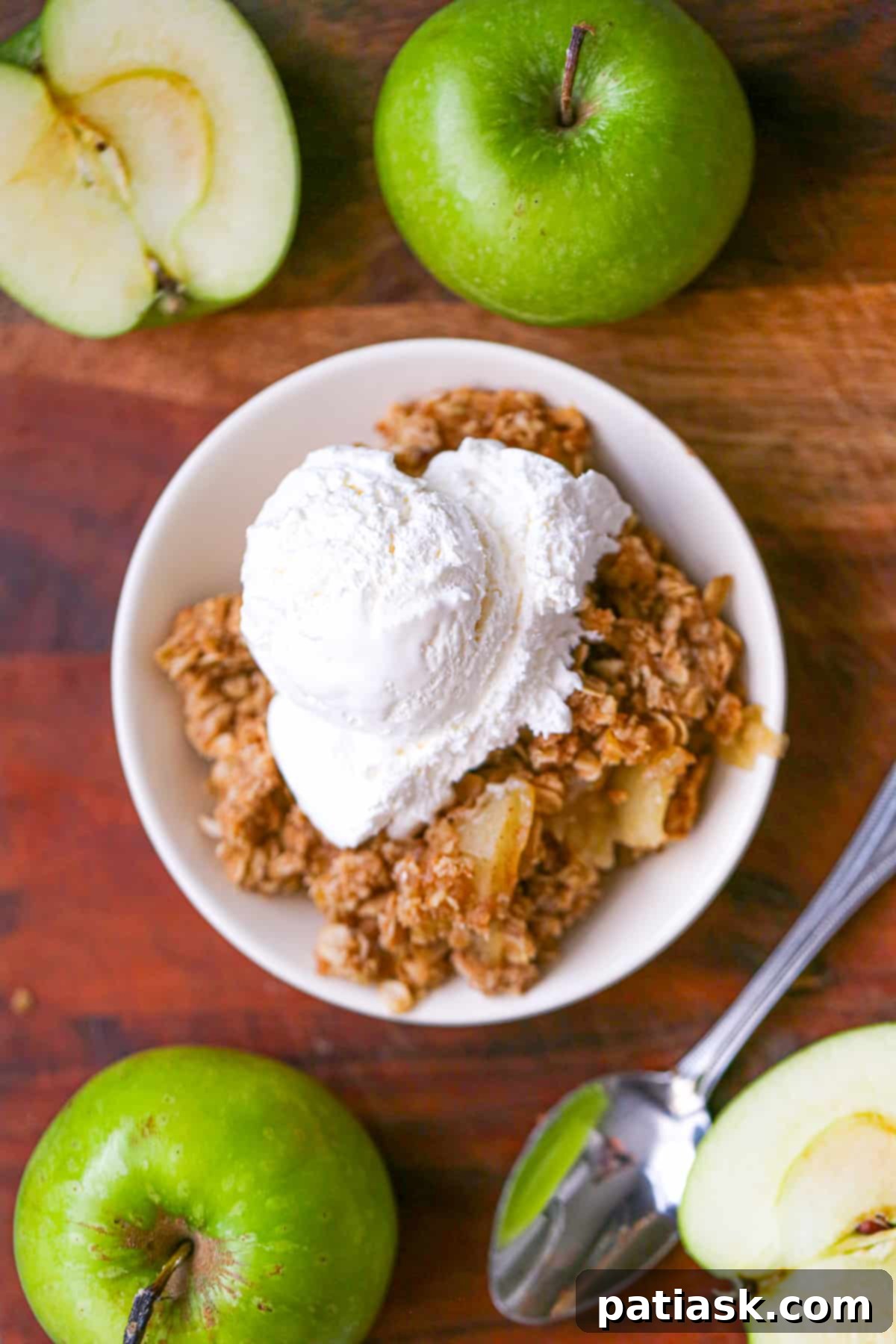Simple & Scrumptious Homemade Apple Crisp 3 Easy Best Baked Apple Oat Crisp Dessert Recipe - Close-up of baked apple crisp with melted ice cream