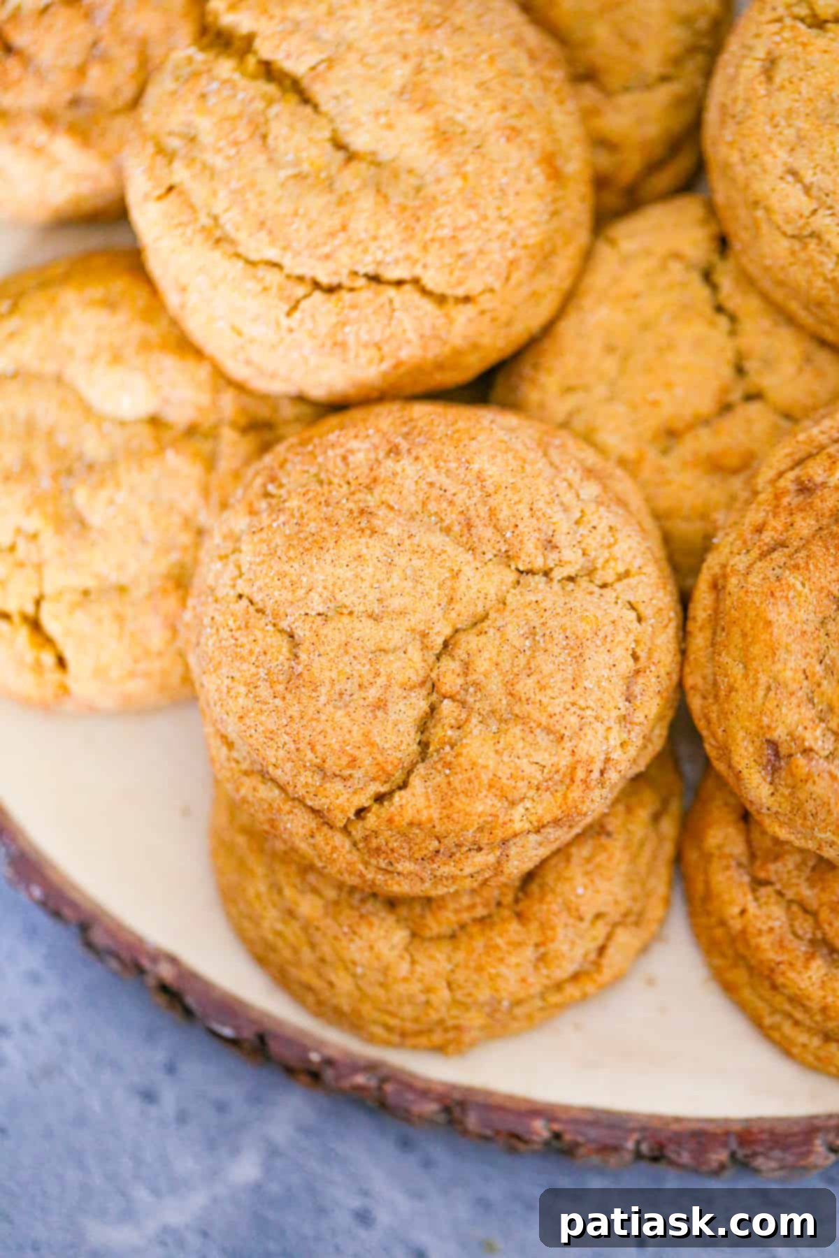 Delicious cinnamon sugar pumpkin snickerdoodle cookies arranged on a cooling rack