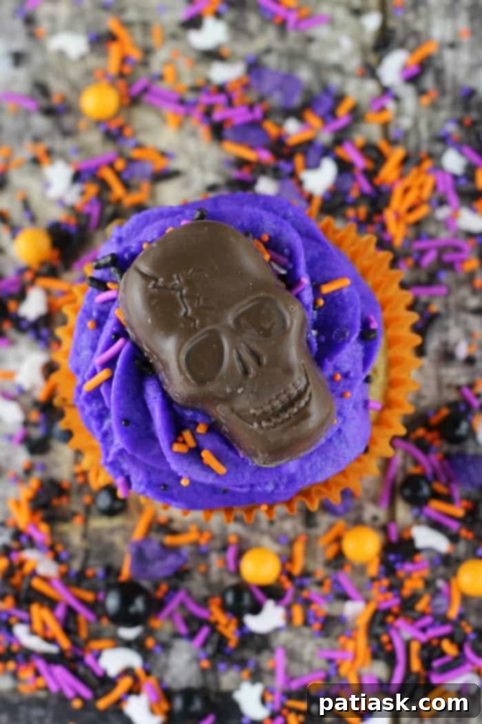 Ghoulish Skull Cupcakes 2 Halloween Skull Cupcakes featuring vibrant frosting and candy skulls