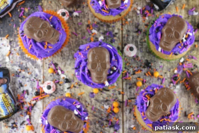 Ghoulish Skull Cupcakes 6 Halloween Skull Cupcakes close up, showing detail of candy and sprinkles