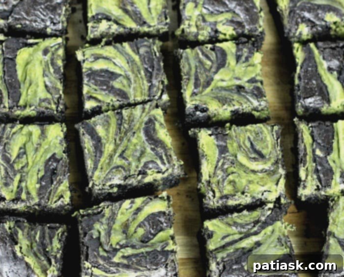 Matcha Swirl Cheesecake Brownies 3 Matcha Cheesecake Brownies, showcasing the beautiful marbled pattern of green tea cheesecake and chocolate.