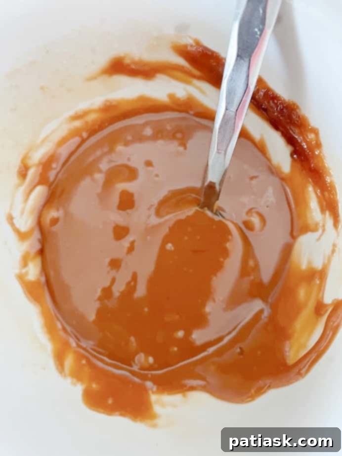 Caramel Apple Cupcakes with generous caramel drizzle and toppings