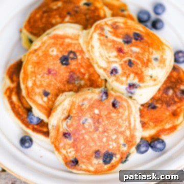 Fluffy Greek Yogurt Blueberry Pancakes on a plate