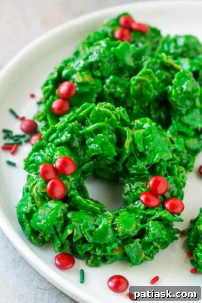 Green No-Bake Christmas Wreath Cookies adorned with festive candies