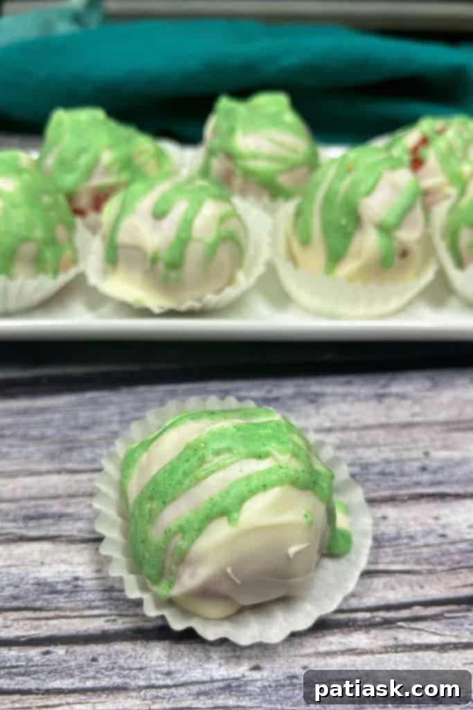 Beautifully decorated Christmas Cake Ball Truffles with sprinkles