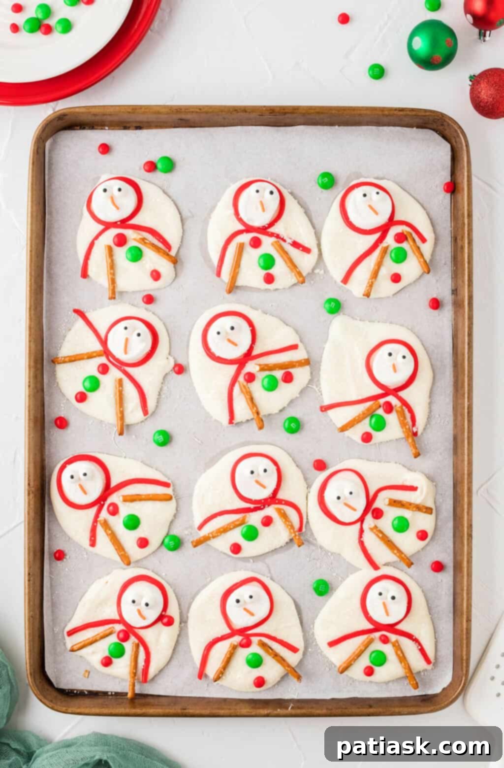 Whimsical Melted Snowman Cookie Bark, a fun white chocolate Christmas candy