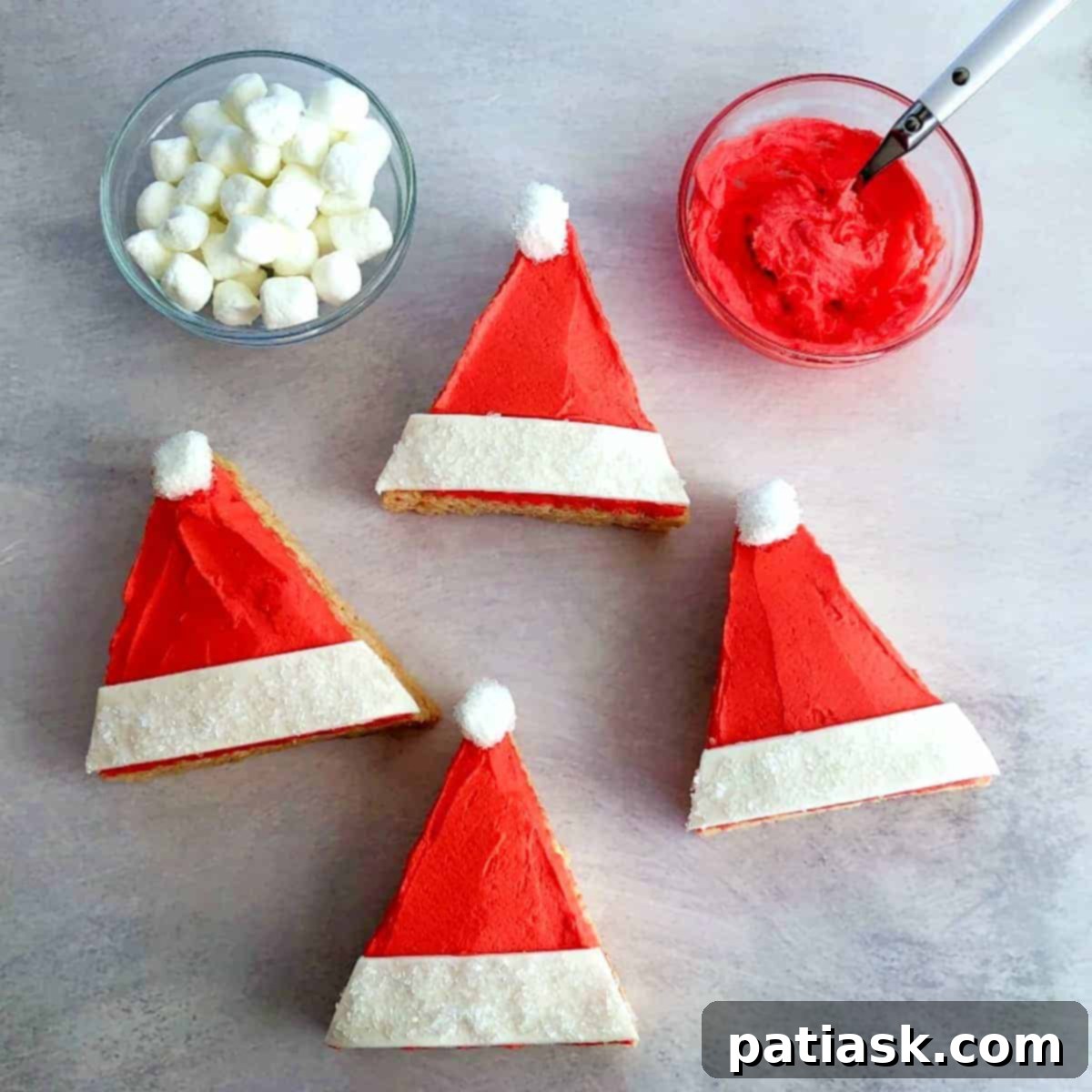Festive Santa Hat Rice Krispie Treats with white and red decorations