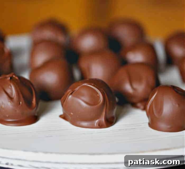 Creamy Milk Chocolate Peanut Butter Truffles covered in a rich chocolate shell